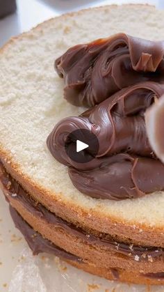 a close up of a cake with chocolate frosting on it and an object in the middle