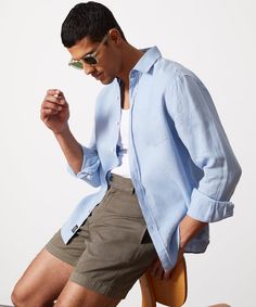 Relaxed Fit Light Blue Linen Tops, Light Blue Relaxed Fit Linen Tops, Classic Light Blue Summer Shirt, Spring Linen Shirt With Relaxed Fit, Light Blue Linen Casual Tops, Casual Light Blue Linen Shirt, Spring Linen Shirt For Casual Gatherings, Casual Light Blue Linen Tops, Linen Spring Shirt