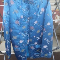 Stunning Vintage Satin Silk Jacket Peony Brand Made In Shanghai China - Size M, Fits Like A Xxl. Chic And Stylish Vintage Piece With Luxurious Style. Features Gorgeous Luxurious Silk Jacquard With Beautiful Colors. Vibrant Cobalt Blue Floral Pattern. Has Hip Pockets. Closure Is A Matching Fabric Button-Front. Condition: See Photos; They Are In Excellent Condition. Size: Xxl, See Measurements. Measures Laying Flat- Pit To Pit 19.5” Across, Shoulder To Shoulder 15.5”, Sleeve Inseam 16”, Full Lengt Blue Floral Embroidered Kimono For Spring, Blue Long Sleeve Kimono With Floral Embroidery, Blue Long Sleeve Outerwear With Floral Embroidery, Traditional Blue Floral Embroidered Outerwear, Kimono Floral, Embroidered Kimono, Blue Floral Pattern, Floral Jacket, Shanghai China