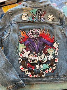 Handpainted Denim Jacket using fabric paint and acrylic paint. Sealed with wax and heat. Lots of delicate details and attention to values, etc. I will come up with a design in collaboration with you to create a truly one of a kind denim jacket that you will treasure for life.  the Denim jacket pictured here is a size large, for kids, I can also do blue denim, light denim, etc.   we can personalize the jacket with name/ text, etc. I'm here to collaborate and make a unique jacket for you! Artistic Hand Painted Fitted Denim Jacket, Artistic Fitted Hand-painted Denim Jacket, Hand Painted Jean Jacket, Painted Pants, Anime Jacket, Diy Denim Jacket, Personalized Jacket, Custom Denim Jacket, Diy Denim