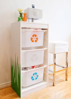 a white shelf with three bins on top of it