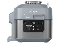 a silver and black ninja blender sitting on top of a white surface with buttons