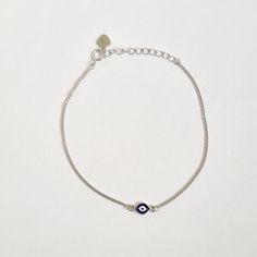 ♢ STYLE Subtle Greek evil eye bracelet crafted from 925 Sterling Silver.  ♢ FEATURES & MATERIALS  :: Made of 925 Sterling :: Dark Blue and White Enamel  :: Chain made of 925 Sterling Silver ♢ SIZE & FIT :: Bracelet length adjustable from 16cm ( 6.29" ) to 19cm (7.48") :: The evil eye size 5mm (0.19") and 4 mm(0.16") ♢ DELIVERY  :: This jewellery is shipped via the international standard shipping service which includes tracking number. :: For delivery in your country please check the 'Shipping & Protection Jewelry, Greek Evil Eye, Evil Eye Bracelet, Bracelet Crafts, Black Ribbon, White Enamel, Gold Plated Silver, Evil Eye, Chain Bracelet