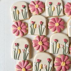 decorated cookies with pink and white flowers on them