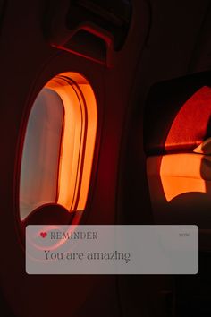 an airplane window with the words reminder you are amazing