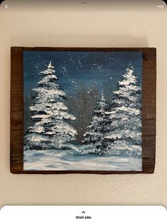 a painting of snow covered pine trees on a wall