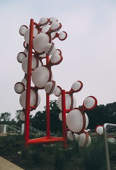 an artistic sculpture with many white and red objects