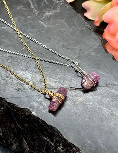 "This Raw Ruby necklace is very elegant in its simplicity.  The Raw Ruby Gemstones are Wire Wrapped and drop from either silver or gold stainless steel chain.  The adjustment chain and clasps are Sterling Silver and 14K Gold Filled.  The stainless chain is hypoallergenic and won't tarnish.  It is very lightweight but extremely durable, and is very comfortable to wear.  There are clear cubic zirconia beads at the closure for added appeal.  The necklace is adjustable from 16\" to 18\". Free Shipping in the USA Gift Box Included My Mission: Create unique and affordable jewelry using quality components such as Sterling, 14K Gold Filled, and Gemstones. This is my passion!  Thanks for supporting me. CARE TIPS ~Remove when sleeping, exercising, or doing other physically strenuous activities. ~Avo Raw Ruby Necklace, Raw Ruby, Ruby Rings, Ruby Necklace, Ruby Gemstone, Affordable Jewelry, Jewelry Cleaner, Ruby Ring, Steel Chain