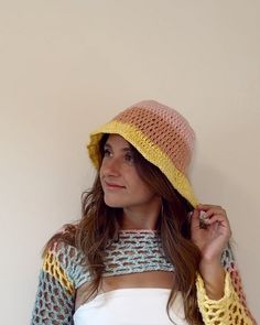 This crocheted bucket hat is so fun and perfect to accessorize any summer outfit! 100% acrylic yarn Colorful Spring Bucket Hat, Colorful Summer Bucket Hat With Curved Brim, Yellow Knitted Crochet Hat For Spring, Colorful Spring Bucket Hat For Beach, Playful Multicolor Bucket Hat For Summer, Multicolor One Size Sun Hat For Summer, Multicolor One-size Sun Hat For Summer, Yellow Crochet Hat For Summer Beach, Yellow Crochet Hat For Summer