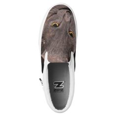 a cat's face is shown on top of a pair of slip - on shoes