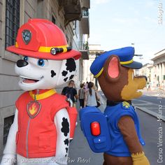 two people in costumes standing next to each other