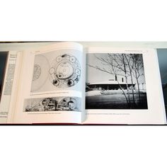 an open book with black and white pictures on it's pages, showing the inside page