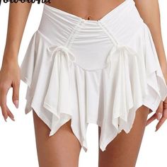 a woman wearing a white skirt and panties