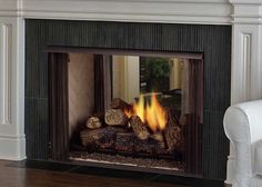 a fireplace with logs in the middle of it