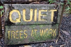 a sign that says quiet trees at work