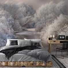 a bedroom with a bed, desk and large wall mural in the middle of it