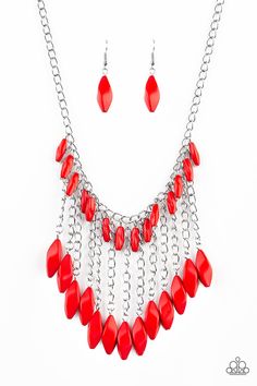 a red necklace and earring set on a white background with chain linked to it