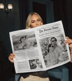 a woman holding up a newspaper in front of her face and looking at the camera