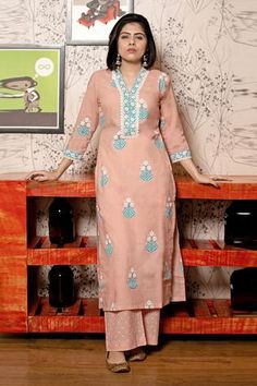 Old rose straight long kurta with floral motif print and lace finish neckline. Paired with pants and mulmul dupatta.
Component: 3
Block Print, Embroidered
Neckline: V Neck
Sleeve Length: Long
Fabric: Cotton Cambric; Dupatta: Cotton Mulmul
Color: Pink
Side slits - Aza Fashions Pakistani Kurta Designs, Dress Design Pakistani, Block Printed Kurta, Designer Dresses Elegant, Pakistani Kurta, Long Kurta, Old Rose, Embroidered Neckline, Indian Fashion Designers