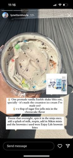 an ice cream sundae in a tin is being held by someone's hand