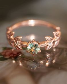 a close up view of a ring with flowers and leaves on the inside of it