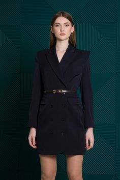 Keep it classic in this double-breasted blazer dress designed with an asymmetrical collar. - notched collar - asymmetrical detail with functional outbreast pocket - long sleeves - double-breasted button closure - functional front flap pockets - shift silhouette - mini length - fully lined Belt is not included. Color: navy Fabric: 65% polyester, 30% viscose, 5% elastane Lining: 95% viscose, 5% elastane For Size 36 EU / 2 US: length - 34.6" (88 cm), sleeve - 24'' (61 cm) Our model wears a 2 US siz Chic Blazer Dress With Notch Lapel And Buttons, Chic Formal Blazer Dress With Structured Boning, Elegant Blazer Dress With Notch Lapel And Structured Boning, Tailored Single Breasted Evening Dress, Tailored Elegant Jacket Dress For Party, Single Breasted Notch Lapel Evening Dress, Elegant Tailored Jacket Dress For Party, Chic Fitted Notch Lapel Blazer Dress, Chic Fitted Blazer Dress With Notch Lapel