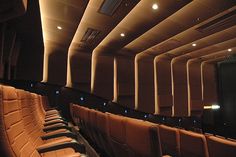 an empty auditorium with rows of seats