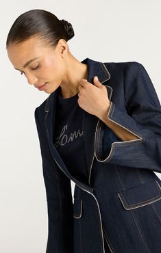 Elevate your style with the Danicka Blazer. Crafted with indigo denim, it features a chic blazer silhouette, collared neckline, and notched lapels. Complete with flap pockets and metallic piping, this blazer adds a touch of sophistication to any look. Upgrade your wardrobe today. Details Button frontFabric: Indigo DenimTailored silhouetteMetallic pipingLong sleeve Content and Care 77% Cotton 21% Polyester 2% ElastaneDry Clean OnlyImported Measurements 27.5in/69.85cm from shoulderMeasurements fro Skirt Coverup, Chic Blazer, Grooming Tips, Cinq A Sept, Blazer Blue, Evening Tops, Short Denim Skirt, Indigo Denim, Denim Outerwear