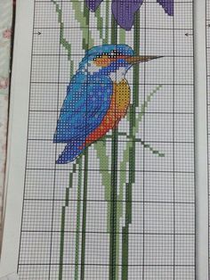 two cross stitch pictures with flowers and birds on them