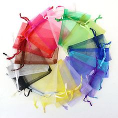 various colors of tulle bags on white background