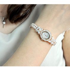 Description: Look great, feel wonderful and sophisticated, wearing this luxurious gold tone and silver tone fully decorated premium quality cubic zirconia crystal watch. And, you can always select the gold tone or silver tone style to add to your collection of watches! This is an excellent choice of stylish crystal watch to own and to wear, designed with premium top quality craftmanship and elegant spackle for you to enjoy! Also, fantastic as a gift to your loved ones!Details: ROYAL CROWN Women' Crown Women, Crystal Watch, Crystal Watches, Crown Royal, Luxury Style, Women's Watch, Crystal Pearls, Fashion Luxury, Crystal Bracelets