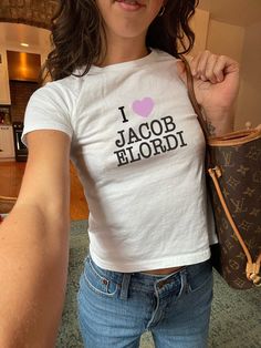 baby tees are so in right now 💕 + Made with 100%, midweight US cotton. +The crew neckline along with the tee's classic fit, deliver a timeless style that is perfect for daily use. + we use YOUTH size for baby tees :) Jacob Eldori, Shirt Ideas Vinyl, Quote For Him, Ironic Tees, Tee Higgins, T Shirt Dress Outfit, Graphic Tee Y2k, Tumblr T Shirt, Jacob Elordi