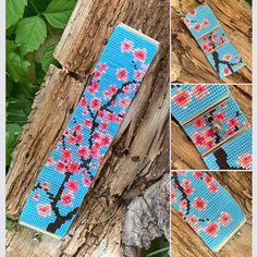 the cross stitch bookmark is decorated with red and pink flowers on blue background, along with green leaves