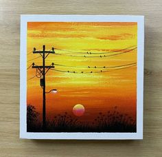 a painting of birds sitting on power lines in the distance with an orange sunset behind them