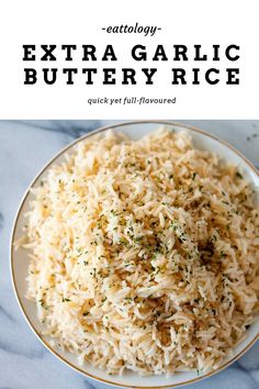 a white plate topped with rice covered in herbs