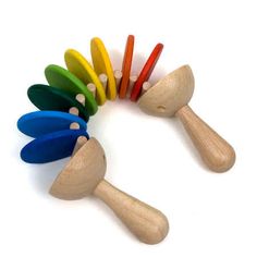 several wooden spoons with different colored handles