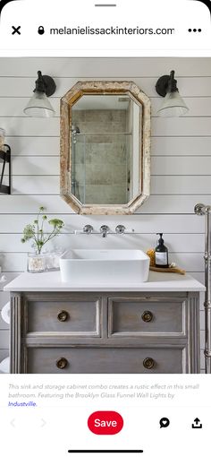 a bathroom vanity with an antique mirror above it