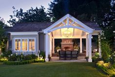 an outdoor living area is lit up at night