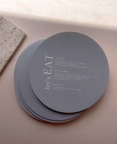 Modern round die-cut wedding menus in a gorgeous blue shade with white script. Round Menu Design, Coastal Wedding Theme, Wedding Food Menu, Vietnamese Wedding, Minimal Wedding Invitation, Menu Cover, Wedding Stationery Design, Charlotte Wedding, Minimal Wedding