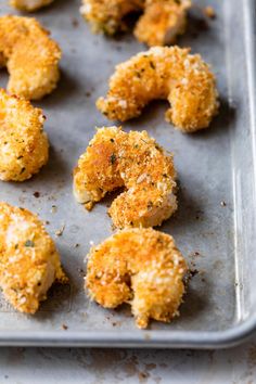 chicken nuggets on a baking sheet ready to be baked