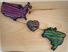 two wooden cut outs with hearts attached to them