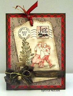 a christmas card with a stamp on it and a ribbon tied around the bottom corner