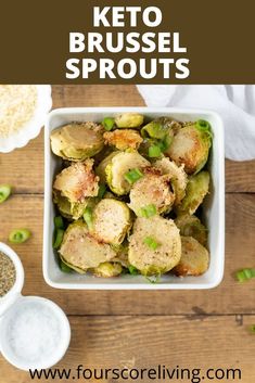 a white bowl filled with brussel sprouts on top of a wooden table