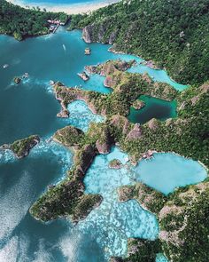 an aerial view of the blue lagoons and surrounding islands