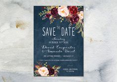 an elegant floral save the date card on a blue background with red and pink flowers