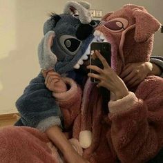 a person in a animal costume taking a selfie with a cell phone