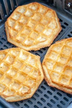 three waffles sitting on top of a grill