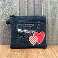 a small purse with two hearts on it