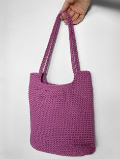 Here's something that is sure to get your attention! Our gorgeous pink shopper bag made on crochet is the perfect addition to your closet. It was handmade and is very practical. It will hold everything you need during the day. Its dimensions are 24 cm wide, 28 cm high, and the handle is 23 cm long. This beautiful handbag adds charm to any styling, and is perfect for any occasion. Don't delay and add it to your collection today! Crochet Cross Body Bag, Everyday Shoulder Bag, Crochet Neck Warmer, Crochet Cross, Beautiful Handbags, Handmade Bag, Bag Crochet, Crochet Bag Pattern, Bag Handmade