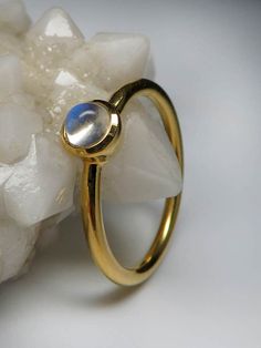 18K yellow gold ring with natural Adularia Moonstone round cabochon moonstone origin - Sri Lanka moonstone measurements - 0.12 х 0.16 х 0.16 in / 3 х 4 х 4 mm stone weight - 0.34 carats ring weight - 2.67 grams ring size - 7 US ref No 3018 Worldwide shipping from Berlin, Germany Feel free to contact us with any questions or for additional pictures or videos. We ship our jewelry worldwide - for our customers it is free of charge and fully insured (with tracking). To ensure that everything arrives Yellow Gold Moonstone Ring With Polished Oval Cabochon, Yellow Gold Moonstone Ring With Oval Cabochon, Yellow Gold Cabochon Opal Ring, Celestial Style Yellow Gold Moonstone Ring, Gold Celestial Moonstone Ring In 14k, Polished Moonstone Ring In Fine Jewelry Style, Polished Round Moonstone Ring In Fine Jewelry Style, Polished Moonstone Fine Jewelry Ring, Yellow Gold Polished Moonstone Ring